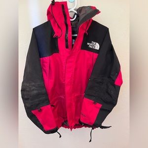 Men’s small red North Face rain jacket.